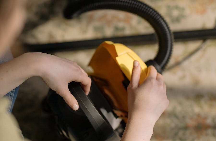 Person Holding Black and Yellow Headphones